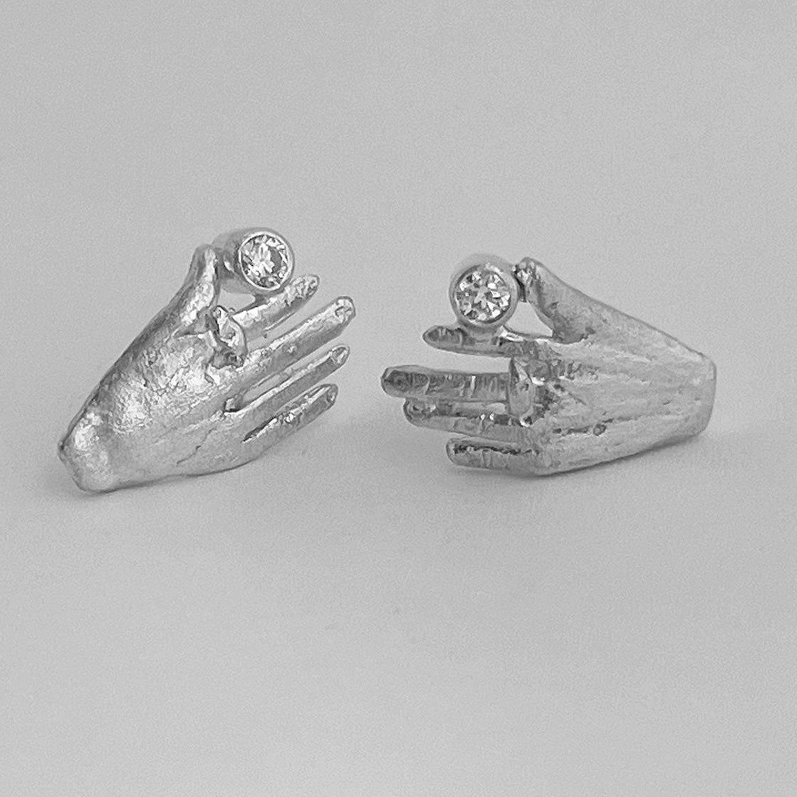 Spark hands earrings