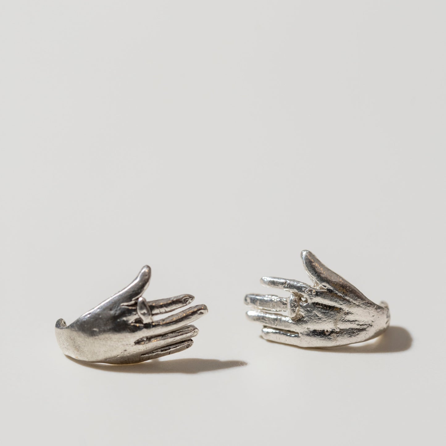 Hugging hands earrings